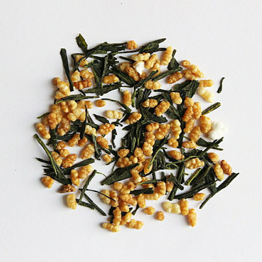 Dry genmaicha against a white background